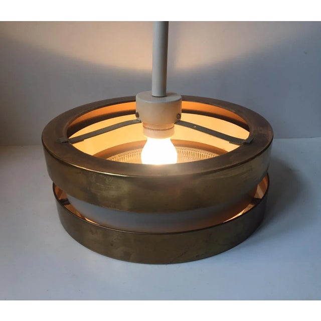 This is a ceiling light by designer Jo Hammerborg. Designed in the late 1950s to early 1960s, this pendant is made of a...