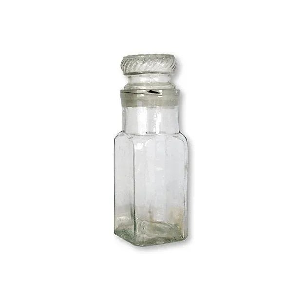Antique French wide mouth apothecary jar. Hand-blown glass with ground glass fitted lid. No maker's mark.