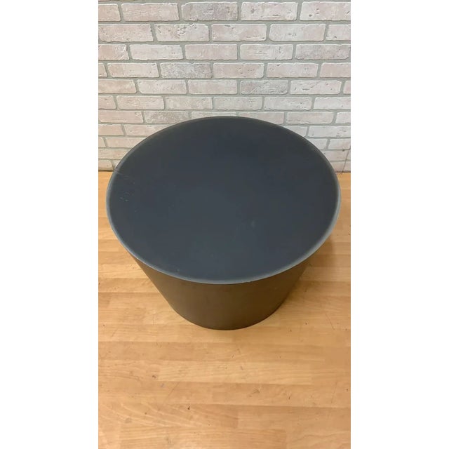 Vintage Modern Round Drum Side or Coffee Table in Patina Metal This modern vintage table is formed from metal with a...
