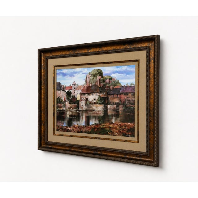 This is a beautifully presented large-scale Robert Duval European village landscape print, professionally framed by...