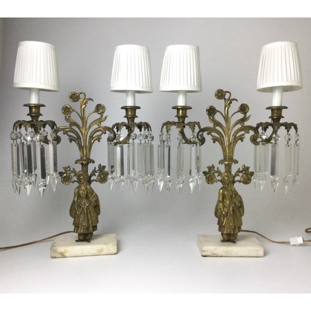 Nice old pair of candelabra that have been electrified. In good working order. Some small chipping to the prisms and 2...