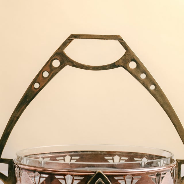 This unique centerpiece embodies the geometric and structural design characteristic of the Arts & Crafts movement and the...