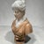 This is a mid-century Italian carved marble bust of a young woman. The bust is carved in two contrasting marbles. The head...