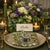 Elevate your table with a touch of quiet luxury: a complete set of 12 vintage pewter duck place card holders, crafted in...