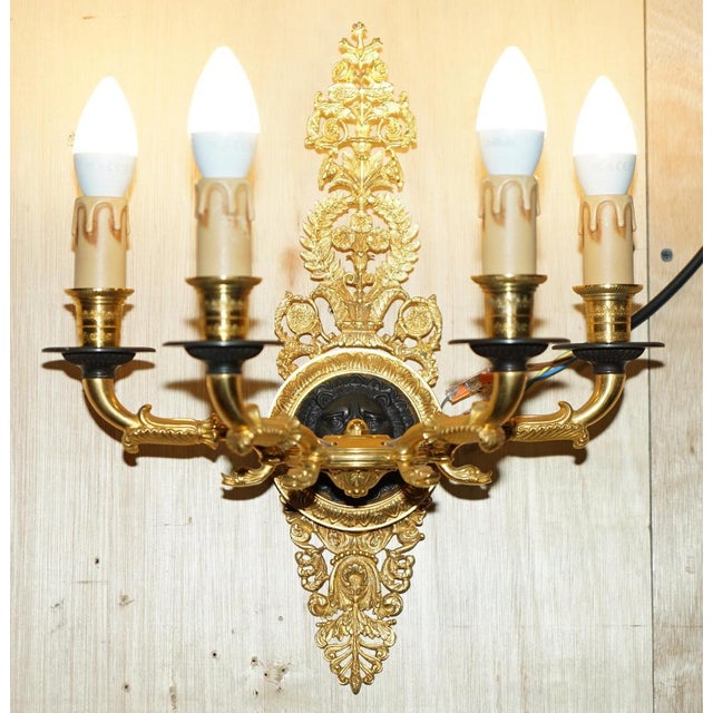 Gold plated four candle branch lion's head bronze wall sconces. Materials:- bronze components casting finish:- polished 24...