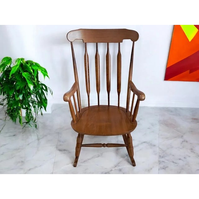 A beautifully crafted solid beech rocking chair, dating from the 1980s. Exquisitely made and exceptionally sturdy, it...