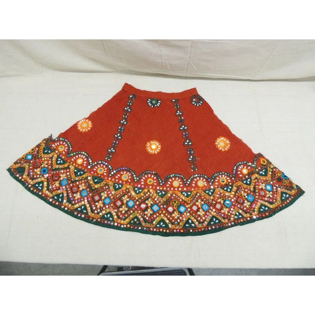 Vintage Indian Embroidered Front Side of a Skirt Textile. With inset, mirrors, beads, sequins and with a seersucker linen...