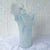 An elegant Italian hand-blown art glass vase crafted in the Murano tradition, featuring a graceful freeform silhouette...