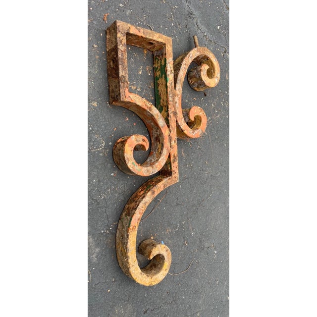 This large antique cast iron corbel bracket is a stunning piece of architectural salvage that would make a great addition...