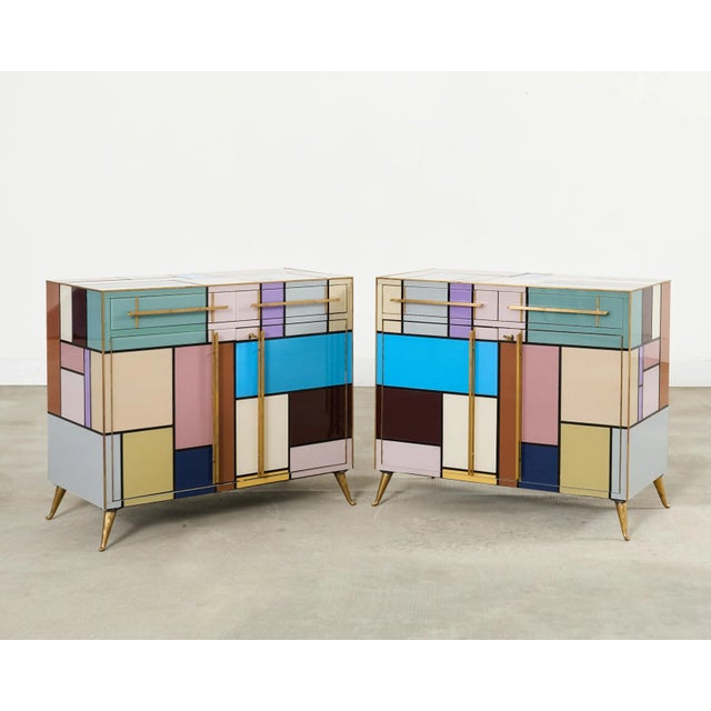 Sublime pair Italian mid-century modern colored glass and brass veneered cabinets inspired by the Dutch painter Piet...