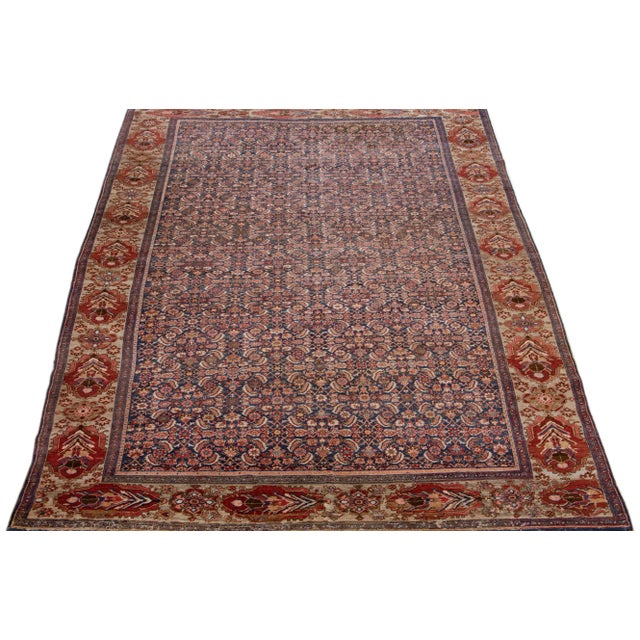 Beautiful antique Bidjar hand-knotted wool rug with a blue color field. This Persian rug has rust, green, and pink accents...