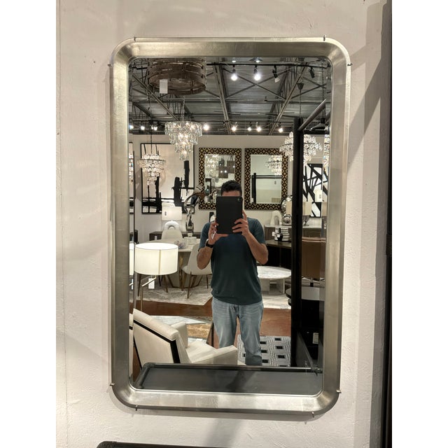 Stylish Caracole Salver Mirror. SIlverleaf color with silver accents. Original Retail $1020. Showroom floor sample.