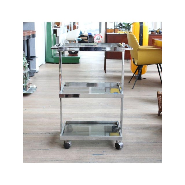 TypeMedical trolley 3 levels / Bar cabinet. Date1 970-79. Style Space Age. Provenance Italy. Materials Chrome steel,...