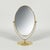 This elegant table mirror was designed and manufactured in Sweden in the 1940s. The mirror features an elegant oval shape...