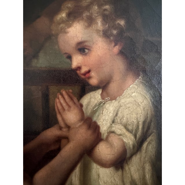 A charming and atmospheric 19th century European oil painting on canvas depicting an intimate domestic interior scene with...