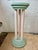 Striking vintage Postmodern pedestal or plant stand dating to the 1980s. The sculptural design features three slender...