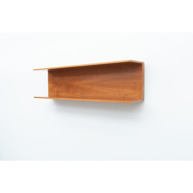 Wall shelf made of walnut, for wall mounting with two hooks. Simple, functional design from the 1960s. Walter Wirz...