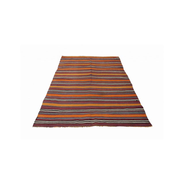 Handwoven vintage striped decorative kilim rug from Denizli region of Turkey. Approximately 50-60 years old. In very good...