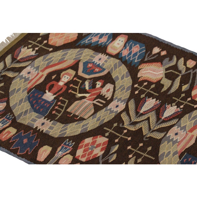 Handwoven in a wool flatweave circa 1880-1890, this 2x3 antique Swedish tapestry is a rich treasure from the Scandinavian...