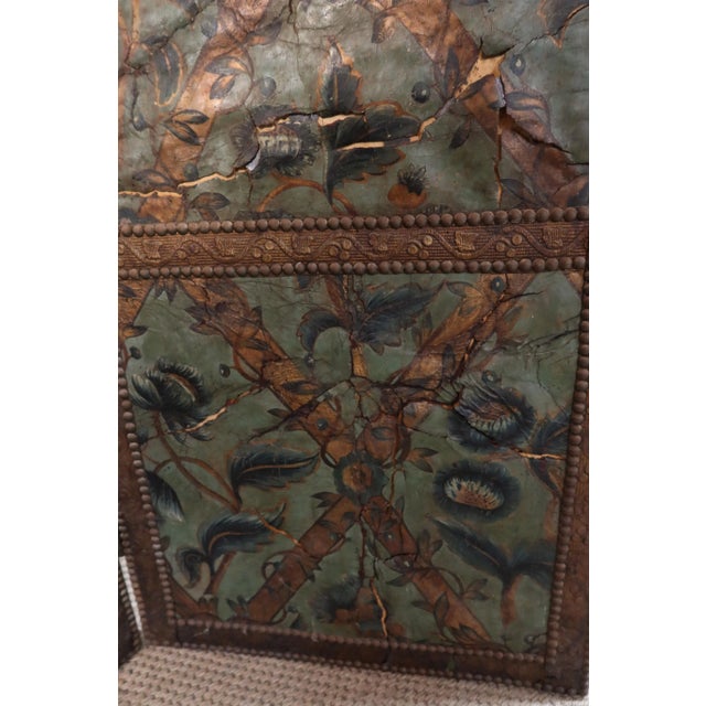 Large four-leaf screen upholstered in 17th-century Cordoba leather. This screen has some damages and tears. A beautiful...