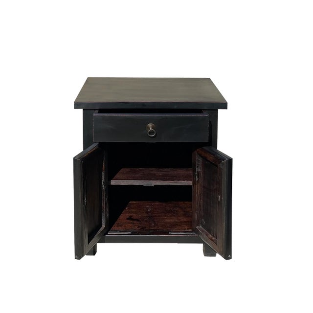 This is an oriental style end table nightstand painted with a matte black lacquer surface color. Simple metal round...