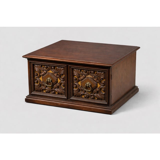 Mobile-Ready Description A striking pair of Spanish Revival carved walnut cabinets featuring intricate relief doors with...