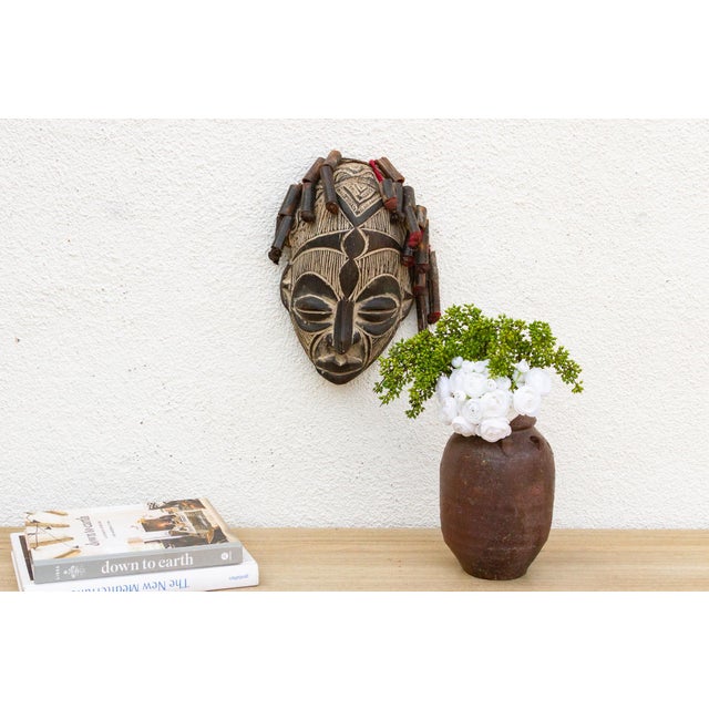 This serene Guro mask from the Ivory Coast is a beautiful example of African tribal art. The mask is characterized by its...