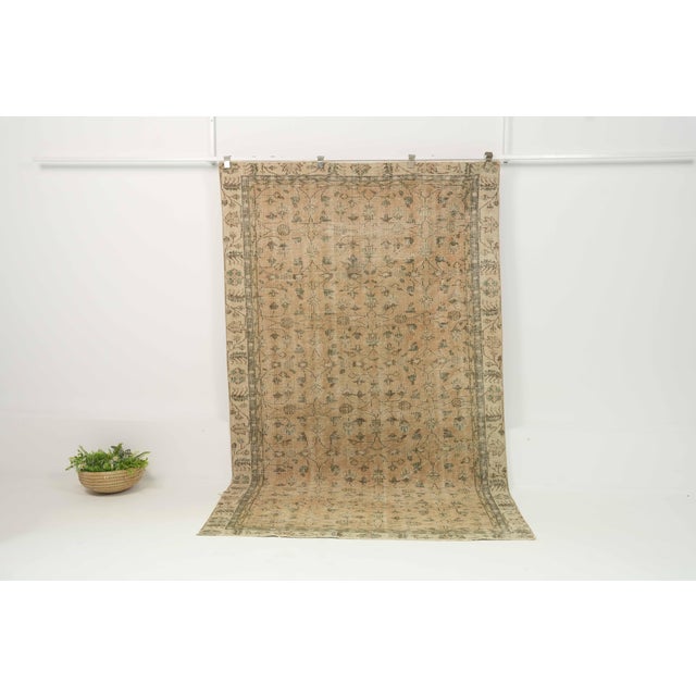Vintage Hand-Knotted area rug is a semi-antique vintage area rug. The '70s Eastern region of Anatolian's unique rug is...