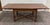 This is a gorgeous vintage solid oak Old English Tudor or Jacobean Revival style draw-leaf dining table featuring turned...