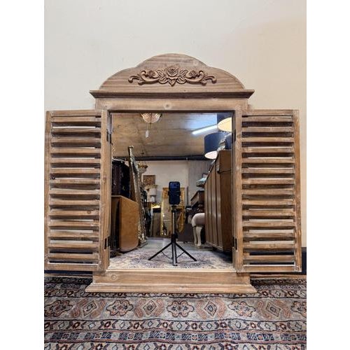 Charming Italian-style window design mirror featuring a wooden frame with a soft whitewashed finish. The shutter-style...