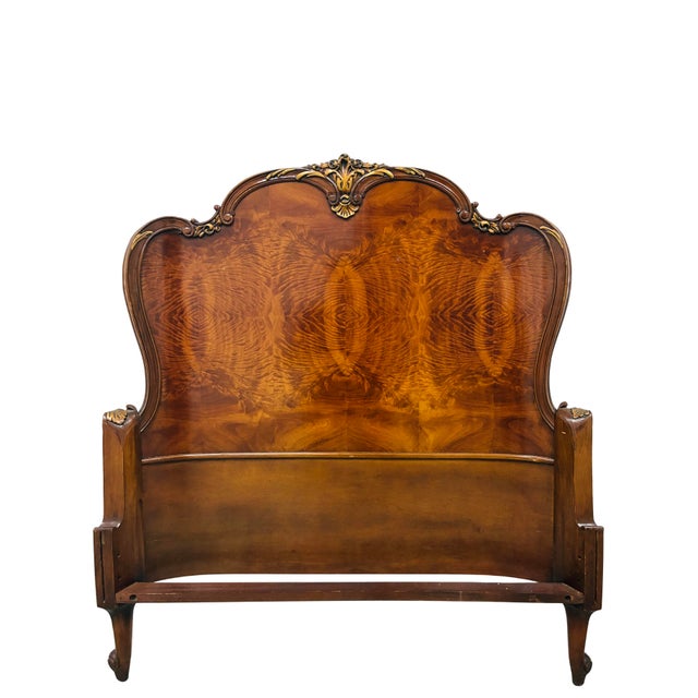 An elegant antique French Louis XV style twin bed crafted in beautifully figured flame mahogany with graceful serpentine...