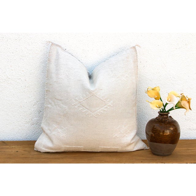 Indulge in the quiet beauty of this handcrafted Moroccan cactus silk pillow, measuring a generous 24 inches square. Woven...