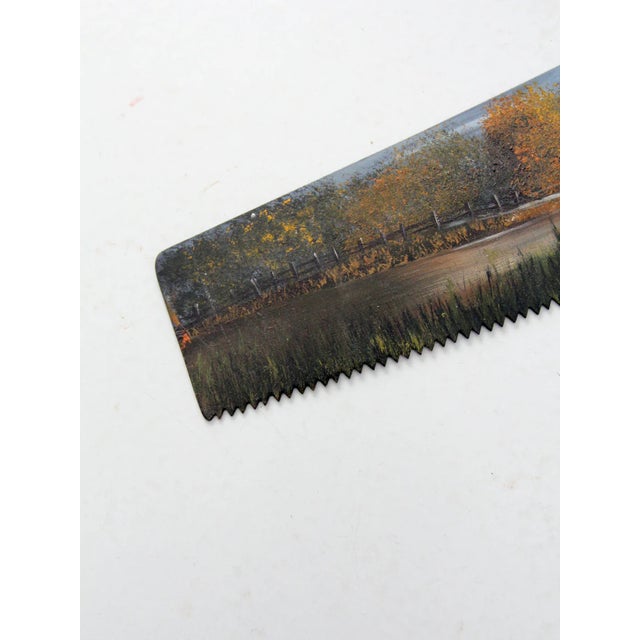 This one-of-a-kind vintage hand saw has been transformed into a unique piece of folk art, featuring a beautifully hand-...