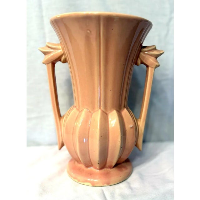 Pretty McCoy Pottery vase in a pale pink with Art Deco style. Circa 1940s.