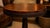 Mahogany book-matched flame grain table. 75-90 years old. Georgian spiral carved tripod legs. Braided leather border,...