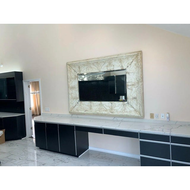 A classically designed, tin covered wood frame mirror with a beautifully textured and distressed Vintage white finish....