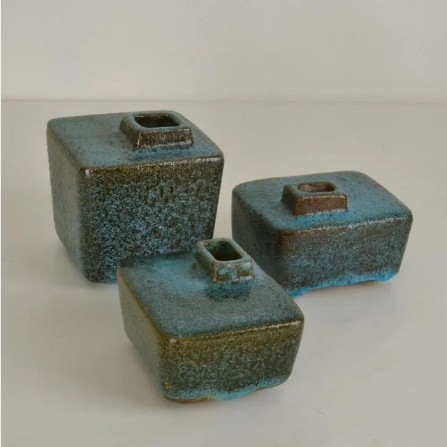 Set of six studio ceramic vases known as block- or chimney vases of various heights 3 in dark purple and turqoise glaze....