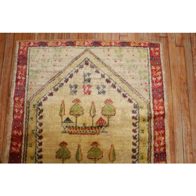 An early 20th century Angora Wool Oushak Rug with a prayer niche design