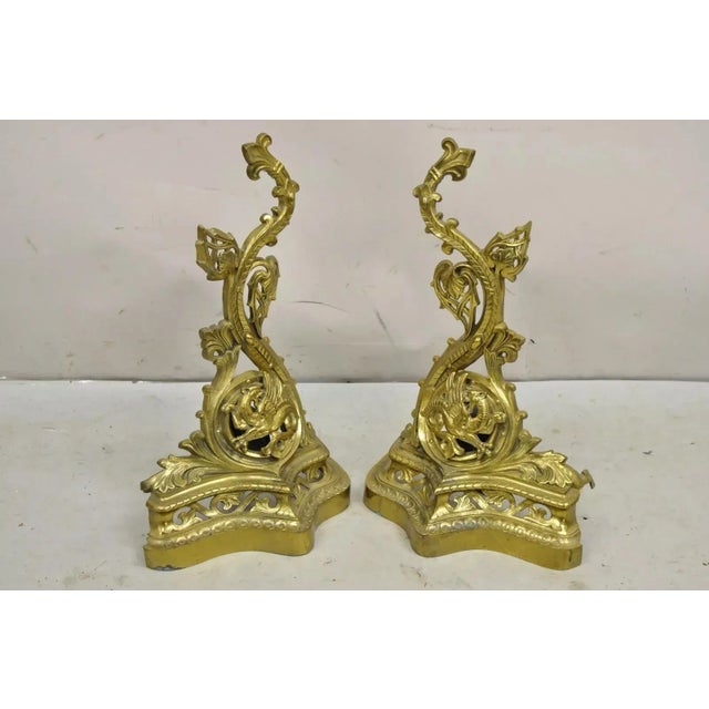 Vintage French Baroque Style Brass Figural Andirons with Dragon Griffins - a Pair. Circa Mid 20th Century. Measurements:...