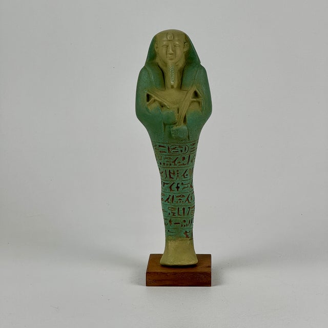 A vintage take on the original shawabty of King Aspelta. A shawabty of ushabti was a funerary figurine used in ancient...