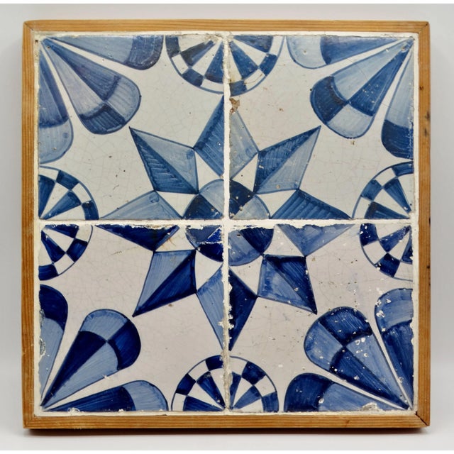 An 18th-Century oak framed Delft star tile plaque consisting of 4 individual tiles. It is a lovely rare decorative display...