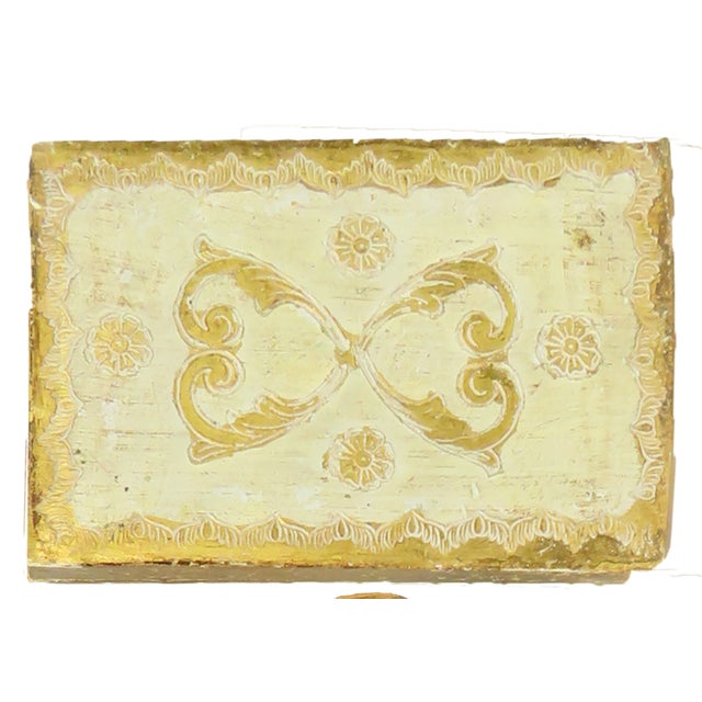 Lovely 2-piece set of Italian Florentine gilded wood decorative accessories. The pair consists of: 1) a round tray with a...