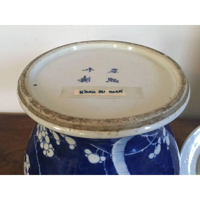 Large antique 19th c. Chinese blue & white porcelain jar & cover decorated in the Hawthorne or prunus pattern with Kangxi...