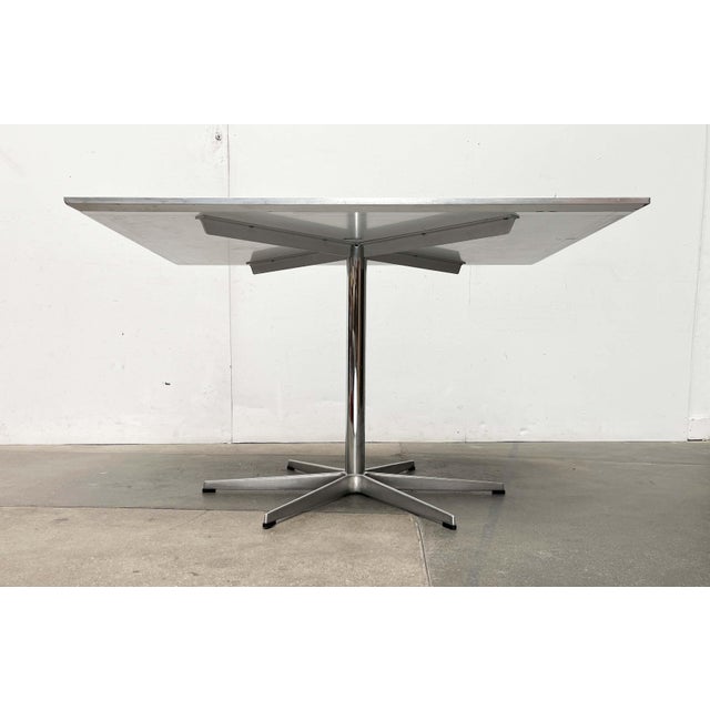 Original dining table by the Danish manufacturer Fritz Hansen, designed by Piet Hein, Bruno Mathsson, and Arne Jacobsen in...