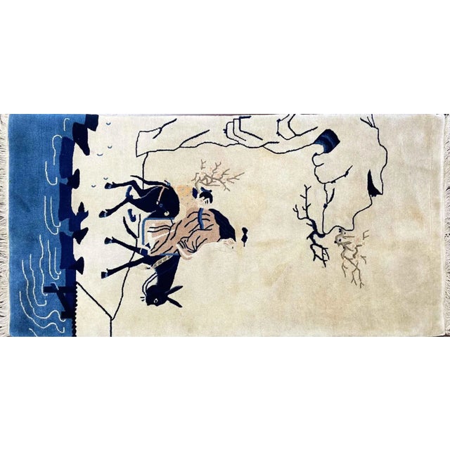 This is an authentic handmade rug. It was made in China around the 1940s . The overall color pallet is ivory over. The...
