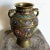 This exquisite antique Japanese Champlevé vase showcases intricate craftsmanship with vibrant enameled floral designs and...