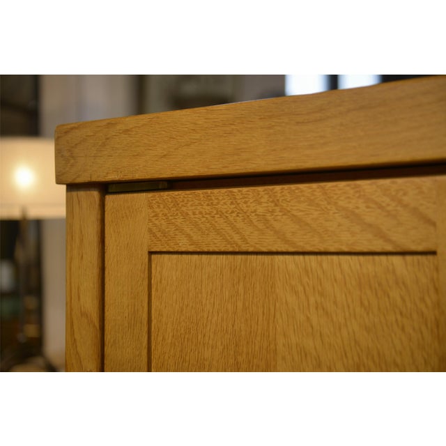 Oak wardrobe attributed to Guillerme and Chambron (1950s), with a warm and highly structured aesthetic. Beautiful...