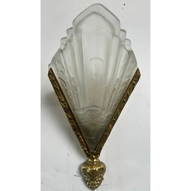 This exceptional pair of authentic French Art Deco wall sconces showcases the height of 1930s modernist design, featuring...