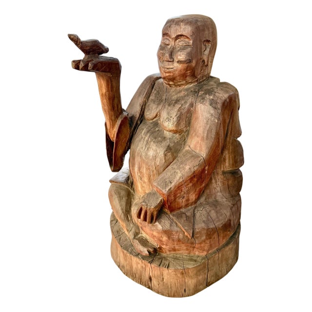 Massive Carved Wood Buddha Holding a Bird For Sale