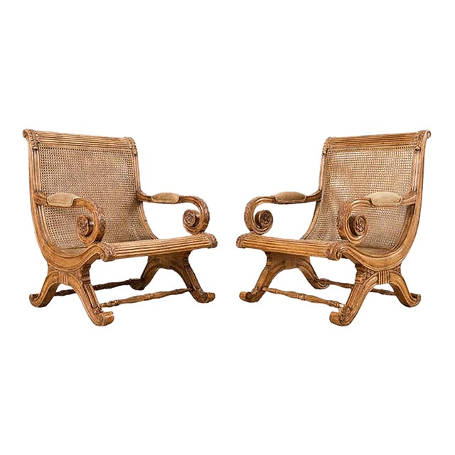 Pair of British Colonial Style Carved Caned Plantation Chairs For Sale
